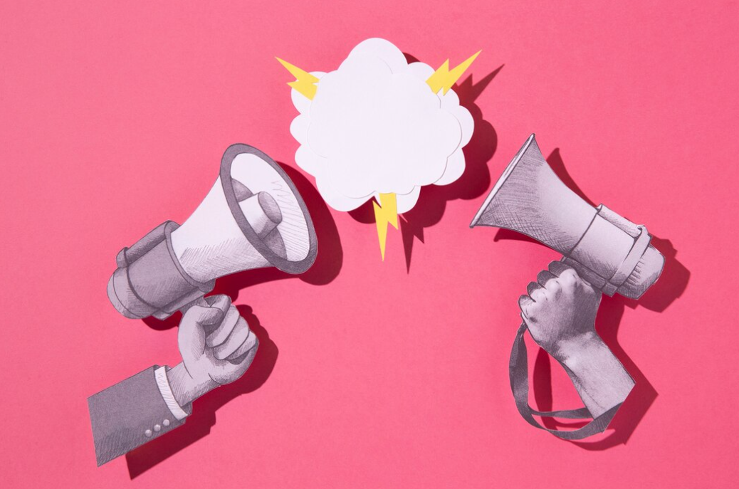 two megaphones in front of each other on a pink background