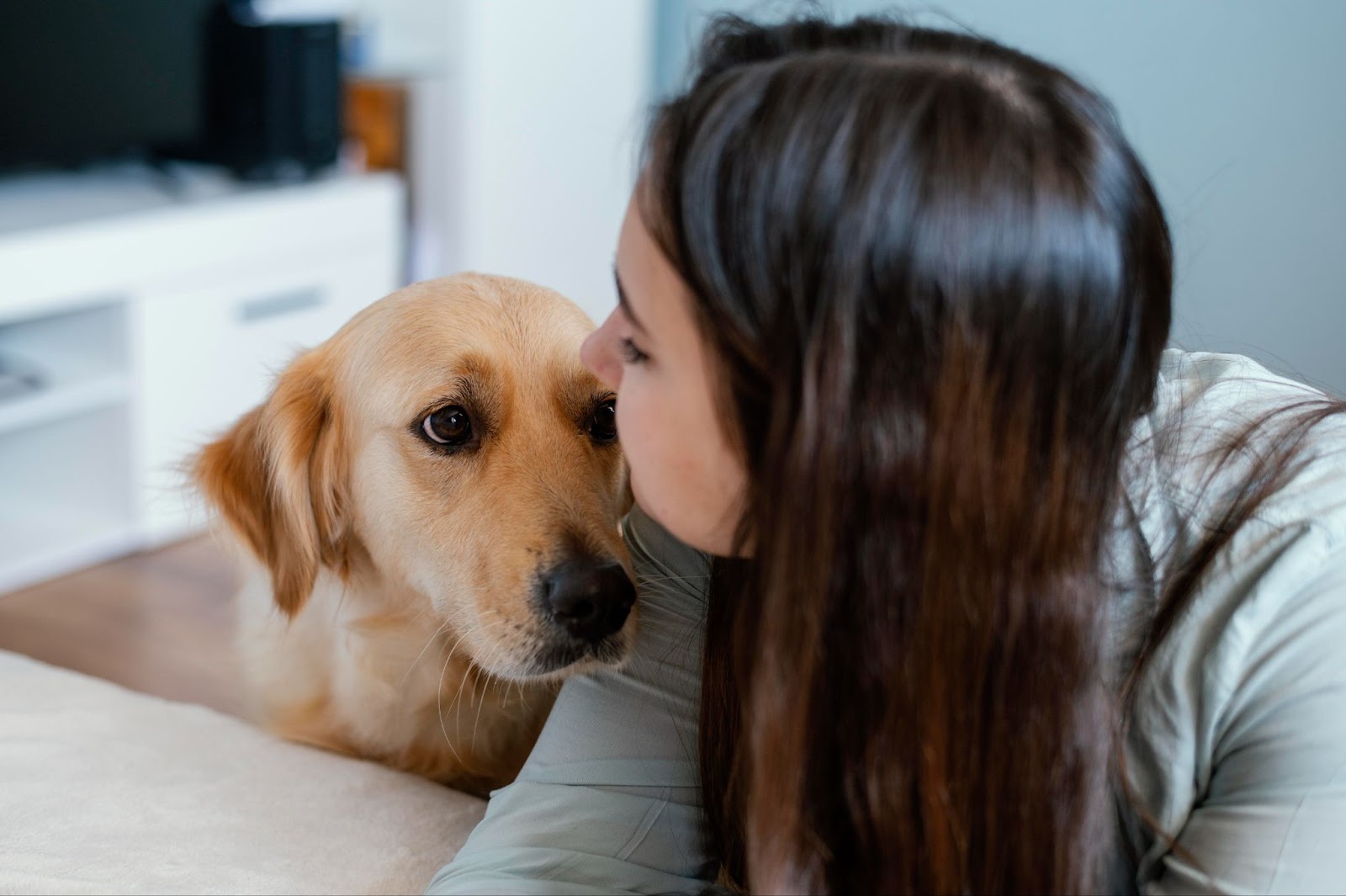 Close up of woman kissing dog