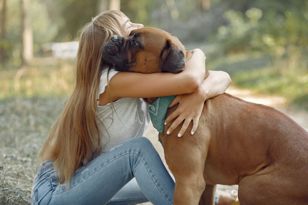 Woman hugging her dog