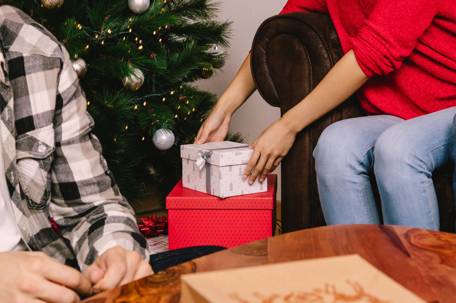 Close up of woman picking up a present